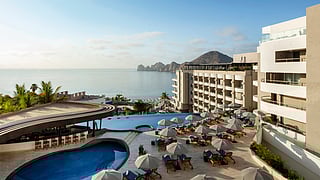 Luxury resort pool deck at Corazón Cabo overlooking the ocean