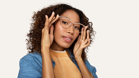 Woman wearing rose gold metal eyeglass frames