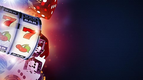 Slot machine reels showing red sevens and cherry symbols