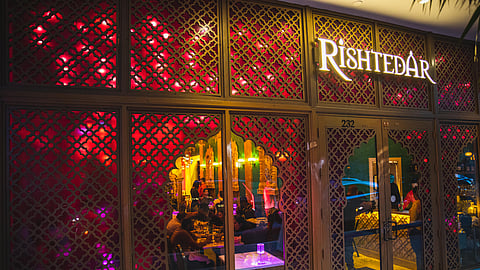 Lit oil lamps and colorful decorations for Diwali at Rishtedar Miami