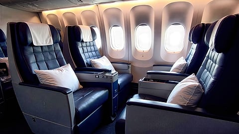 Luxurious first-class airplane cabin with spacious leather seats