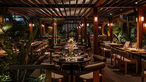 Outdoor dining terrace at night at Yamashiro Miami