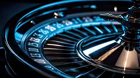 Close-up of roulette wheel under blue light symbolizing casino luxury
