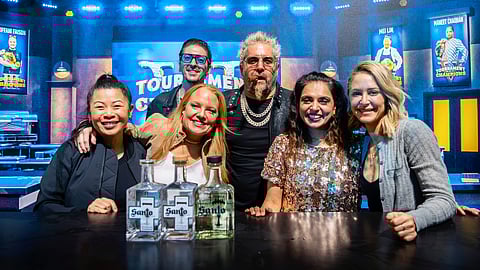 Guy Fieri with chefs at SOBEWFF 2025 Tournament of Champions event.
