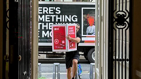 Avant-Garde mover delivers boxes from branded truck in NYC