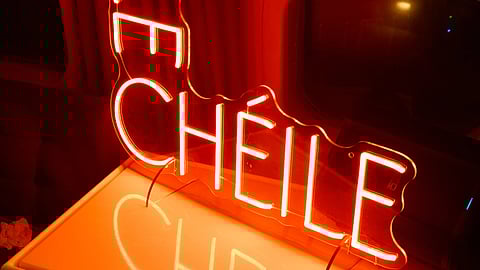 Le Chéile neon sign glowing red at the TWA Hotel launch event.