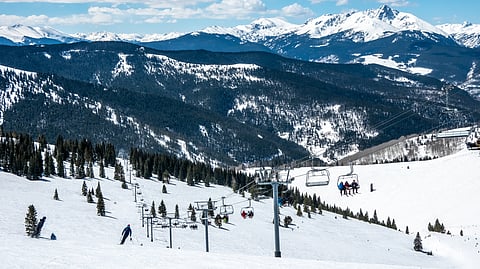 Skiers and chairlifts on snow-covered slopes at Vail, Colorado
