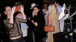 Guests view the Salvagni and Manolo Blahnik display at The Miami Beach EDITION