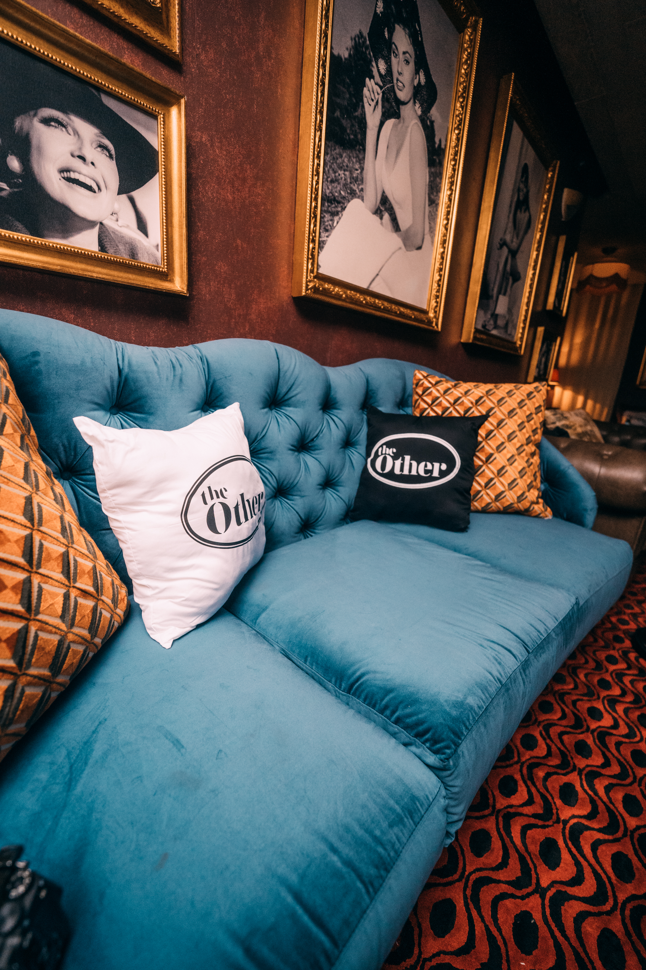 Sofa with TheOther branded pillows