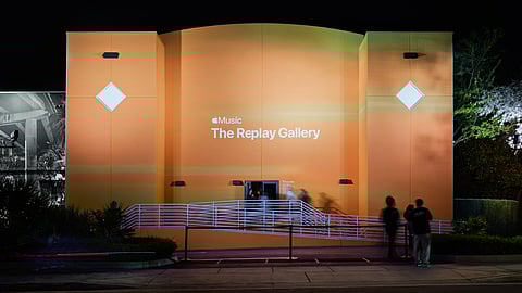 Exterior of the Replay Gallery lit in bright orange during Miami Art Week
