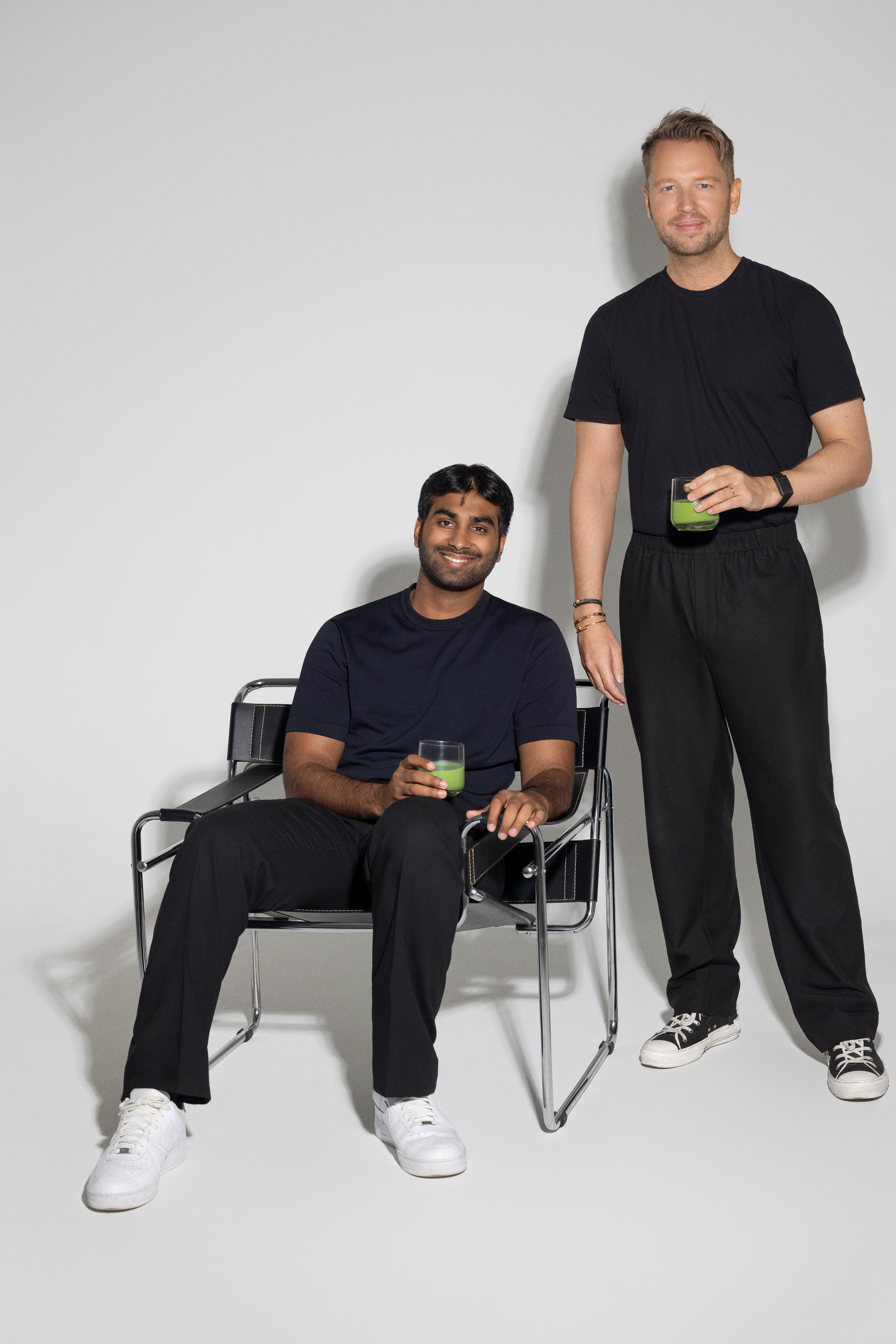 Two founders pose with glasses of matcha during the brand’s launch