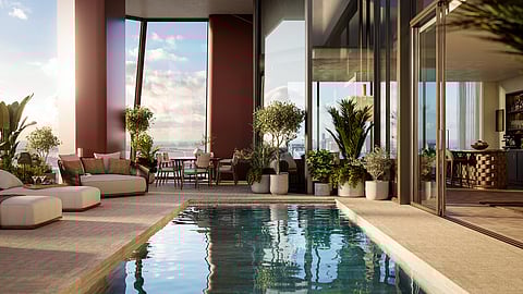 Pool terrace with lounge seating and bay views at Villa Miami