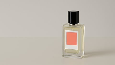 Minimalist luxury fragrance bottle photographed against a neutral background
