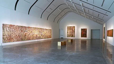 Wide gallery view of Sam Falls paintings displayed at Ruinart’s Art Basel Miami installation