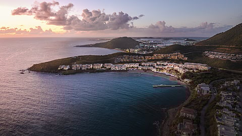 Aerial view of The Setai St. Maarten resort along Indigo Bay at sunset