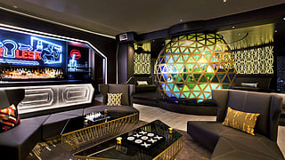 Modern lounge interior at W New York Times Square with neon bar and geometric design