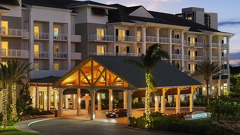 Exterior view of the Belgrove Resort & Spa entrance illuminated at dusk