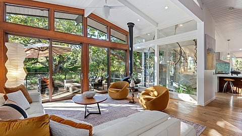 Mid-century modern living room with floor-to-ceiling windows in Jane Russell’s Montecito estate