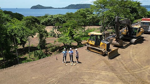 Groundbreaking ceremony with construction equipment overlooking the Gulf of Papagayo in Costa Rica