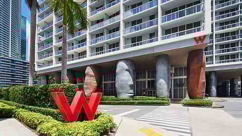 Exterior view of W Miami hotel in Brickell with palm trees