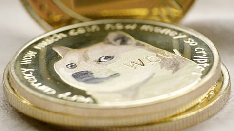 Close-up of a Dogecoin cryptocurrency token symbolizing meme coin trading and market volatility