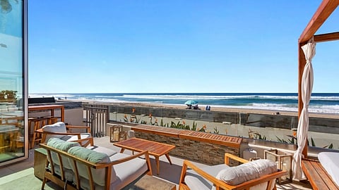 Oceanfront patio with lounge seating overlooking Mission Beach and the Pacific Ocean