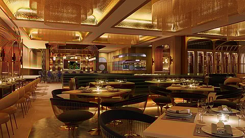 Gold-accented dining room at ORO Miami with ambient lighting and elegant table settings