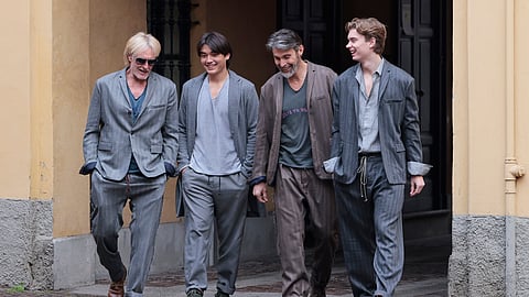 Group wearing Warped FW 26–27 menswear walking together during Milan Fashion Week