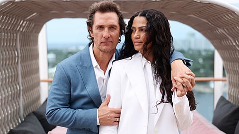 Matthew McConaughey with his wife Camila Alves at a public event