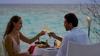 A romantic Valentine's Day cheers at Vakkaru Maldives in Baa Atoll beside the beach