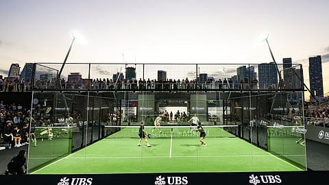 Professional padel players competing on a glass court at Reserve Cup Miami