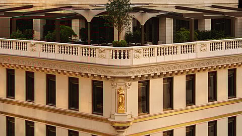 Exterior of Aman New York at the Crown Building, featuring a terrace above Fifth Avenue