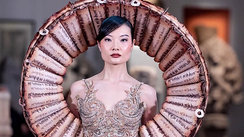 Model in embellished gown at Oriental Fashion Show Paris SS26