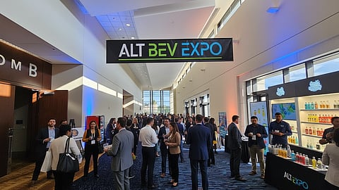 Crowd of guests networking and sampling alternative beverages under AltBev Expo signage