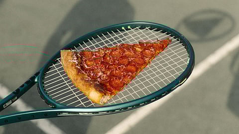 Miami Slice pepperoni on tennis racquet 