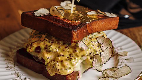 Truffle-topped sandwich with melted cheese and mustard sauce at Honeysuckle