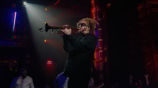 Musician performs trumpet on stage at Faena Theater Everafter show in Miami Beach