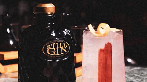 Still G.I.N. by Dre and Snoop bottle beside the Still Paloma cocktail at Mio Lab