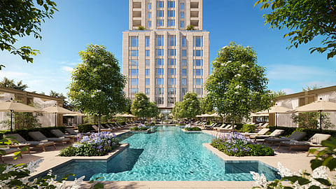 Resort-style courtyard pool with lounge chairs and landscaping at Ritz-Carlton Residences Houston