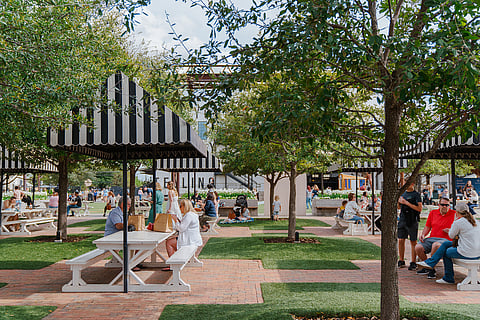 Visitors enjoy the lawn at Magnolia Market at the Silos during Spring at the Silos in Waco. 