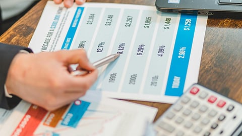 Investor reviewing depreciation schedule and tax documents for real estate accounting strategy