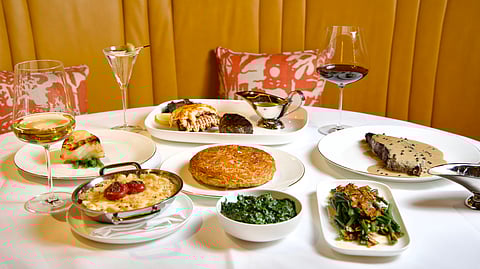 Steak, lobster, and classic steakhouse sides served at SLIM’S restaurant