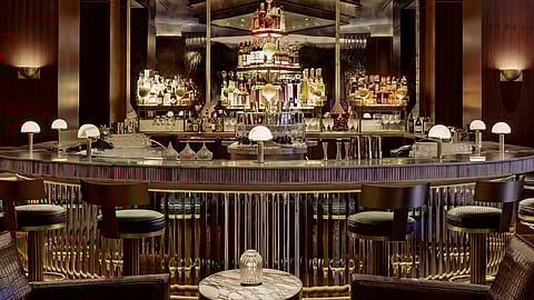 Modern bar interior at Zero Bond Las Vegas with illuminated bottles and seating