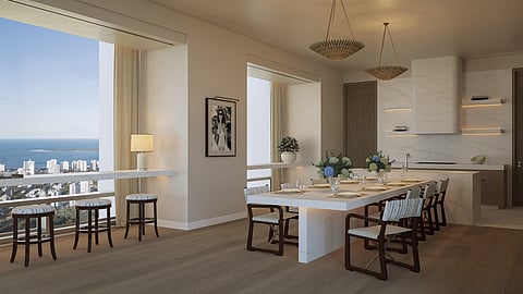 Dining table and kitchen with large windows overlooking Punta del Este coast