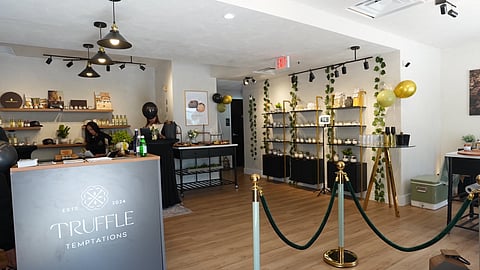 Wide shot of store interior with counters, shelving, and truffle products arranged throughout