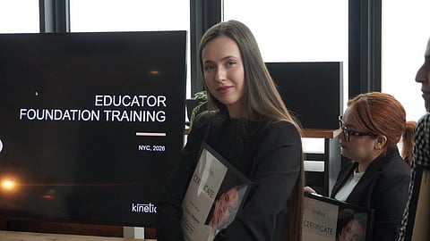 Vikki Swan holding certificate at nail educator training event in NYC