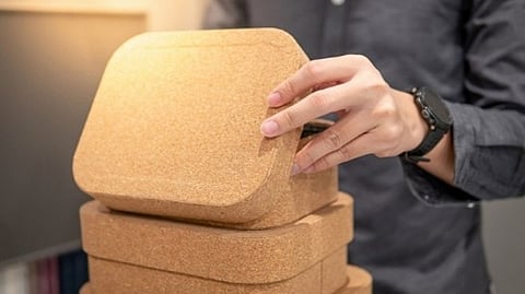 Person arranging customized product packaging for branded promotional merchandise