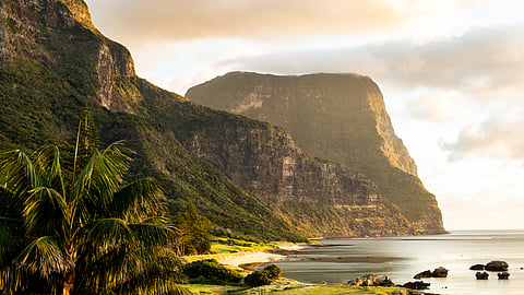 Coastal mountains and lagoon at Capella Lodge on Lord Howe Island during golden hour