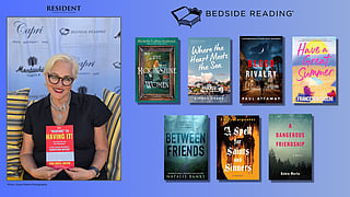 Woman holding a book beside featured novel covers in bedside reading display