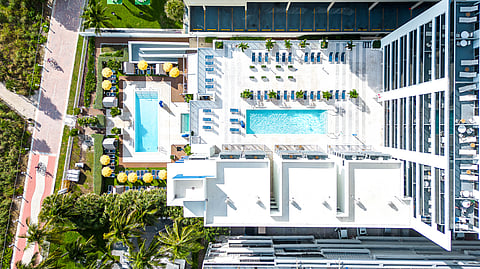 Aerial view of Hilton Cabana Miami Beach pool deck and oceanfront boardwalk